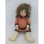 A bisque headed doll stamped 'S.F.B.J. 247 Paris', 18" tall.