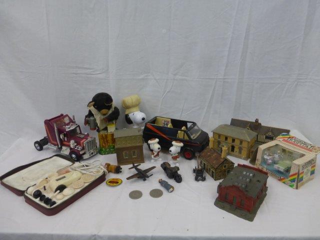 A box of assorted toy collectables including railway buildings, Snoopy, clockwork bear, etc.