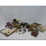 A box of assorted toy collectables including railway buildings, Snoopy, clockwork bear, etc.