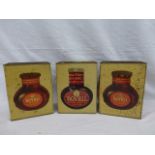 Three Bovril shop display tins, each with different wording to the ends.