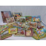 A box of assorted puzzles and children's volumes.