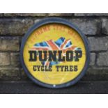 A Dunlop Cycle Tyres circular showcard set within a tyre, 26" diameter.