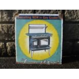 A pictorial enamel sign depicting a gas cooker with the slogan 'Something NEW in Gas Cookers', 15