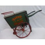 A Lines Brothers miniature Baker/Confectioner wooden cart with metal wheels.
