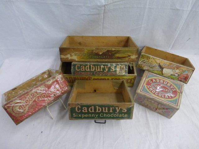 Seven dispensing crates advertising Cadbury's Chocolate.