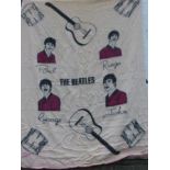 A Beatles Whitney woollen blanket, printed with portraits of all four Beatles and with musical