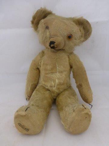 A Merrythought jointed teddy bear.