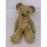 A Merrythought jointed teddy bear.