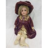 A bisque headed doll stamped 1349 Dressel S&H, with early, possibly original clothing including a