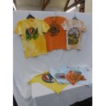 An assortment of original 1970s tee-shirts including rock band the Grateful Dead, a vest with