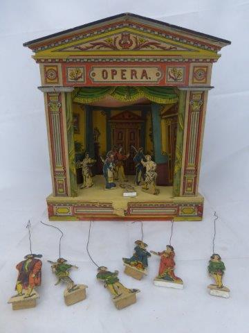 An early wooden and paper covered 'opera' theatre with many cardboard and wire controlled actors.