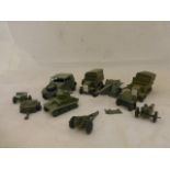 A selection of play worn Dinky military models, including two early six-wheeled lorries.