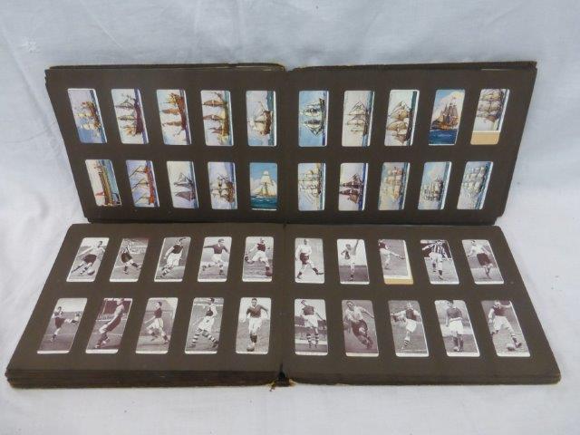 Two albums of cigarette cards to include footballers, boxers, military, vintage cars, cricketers,