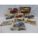 A collection of eight unmade Matchbox kits, mostly relating to classic cars.