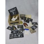 A selection of early cardboard price cards, some branded.
