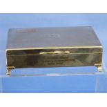 A silver plated Cigarette Box, of rectangular form with hinged lid and bracket feet, 6½in (16.5cm)