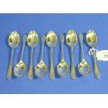 A set of nine silver 'golf' Teaspoons, by Walker & Hall, seven hallmarked Sheffield, 1932 and