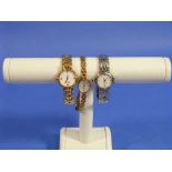 Three lady's Wristwatches, one by Soverign, mounted in 9ct yellow gold and with 9ct yellow gold