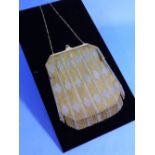 An attractive Art Deco style mesh Evening Bag, of yellow and white metal in a chevron pattern, the