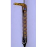 A Stock Pin, of a riding crop in 15ct yellow and white gold, 5.8g.