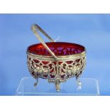 A Victorian silver-plated and cranberry glass Sugar Bowl, of pierced ovoid form with swing-handle