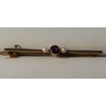 A 9ct yellow gold Bar Brooch set with small circular amethyst and two small cultured pearls.