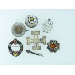 A collection of silver Scottish Jewellery; two brooches set with citrines and coloured agates, one