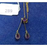 A 15ct yellow gold Pendant, the trace chain set in the centre with circular amethyst and with two