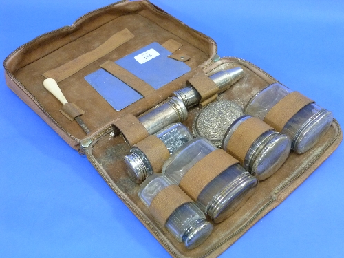 A four-piece silver-mounted cut glass travelling Vanity Set, incomplete, in fitted leather case, and