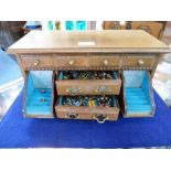 An Oriental wooden Jewellery Casket,  with turquoise velvet interior containing a quantity of