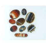 A collection of nine Agate Brooches, some striated, some plain, in gilt metal and silver mounts (9)