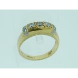 A 14ct yellow gold diamond set Dress Ring, with three central diamonds c.0.20ct. each and with two