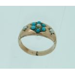 A turquoise and seed pearl flower head Ring, in 9ct yellow gold mount, Size M.