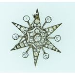 A six pointed diamond set star Brooch, each point set with five diamonds, with a single millegrain