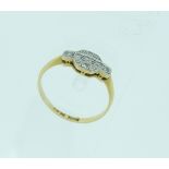 An 18ct yellow gold Ring, the front set with small diamond points, Size M.