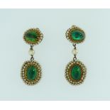 A pair of Indian drop Earrings, with an oval top and drop, set with small seed pearls and a foiled