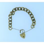 A 9ct yellow gold facetted curb link bracelet, with a padlock clasp and safety chain also in 9ct