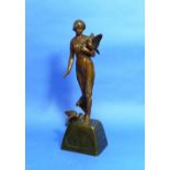 A continental Art Nouveau bronze figure, of a woman and pigeons, on shaped square base, 11⅝in (29.