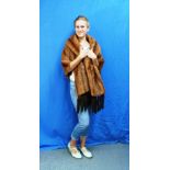 A vintage Marmot fur Wrap/Short Cape, with long rever, cross over back and detachable fur tassles at