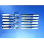 A set of twelve Edwardian silver and mother-of-pearl dessert knives and forks, by Harrison Fisher,