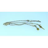 An 18k yellow gold Chain, with five fancy links and with an 18k key suspended and a Madonna plaque