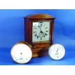 An early 20thC oak Mantel Clock with alarm, with square white dial and Roman numerals, arched inlaid