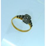 An Art-Deco style Dress Ring, of oblong centre with stepped shoulders with small diamond points,