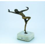 An Art Deco gilt bronze figure of nude Dancer, on square polished white stone base, 5in (12.5cm)