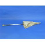 A late 19thC / early 20thC Parasol, the ivory handle with carved decoration, on a folding shaft with