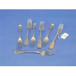 Seven various early 19thC silver Forks, fiddle pattern, the handles monogrammed, approximate total