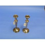 A pair of George V silver Candlesticks, hallmarked Birmingham, 1920, each with a vase-shaped capital