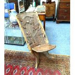 A vintage Malawian two piece Mpingo wood (African Ebony) Chair, with tribal carvings. THIS LOT