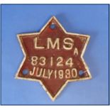 A Wagon Plate, LMS A 83124 July 1930, red and white, star shaped, 6½in (16.5cm) wide.  THIS LOT WILL