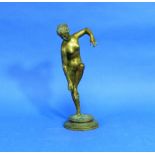 An early 20thC bronze Nude, standing on circular base and holding her ankle, 9⅜in (24cm) high.  THIS